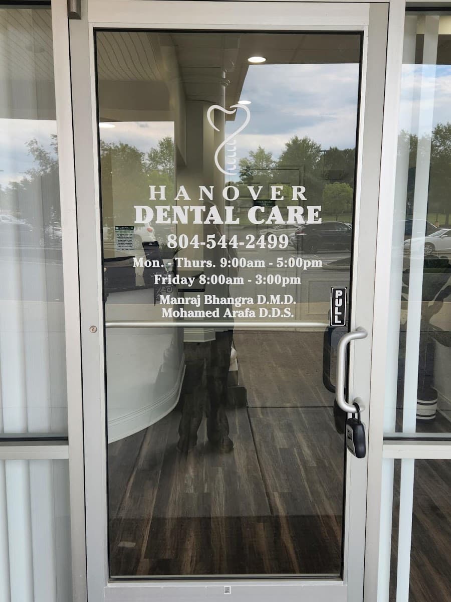 The front door of Hanover Dental Care, listing Dr. Bhangra and Dr. Arafa